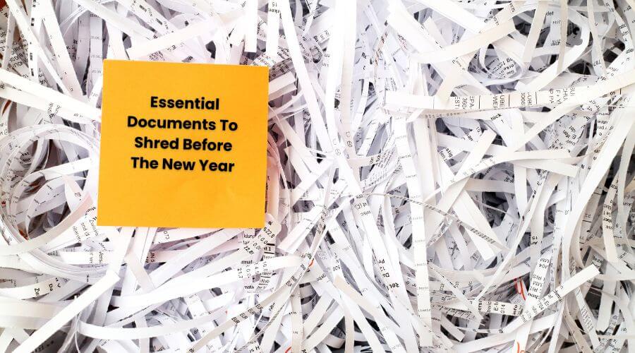 image of shredded paper with note on top that says "Essential Documents To Shred Before The New Year" 